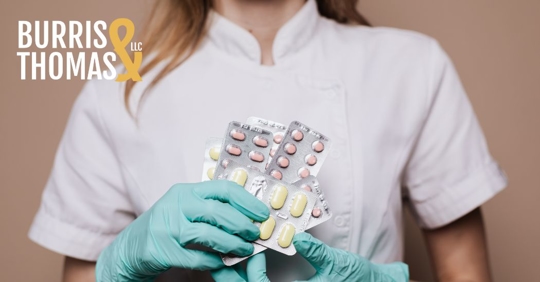 healthcare professional holding pills