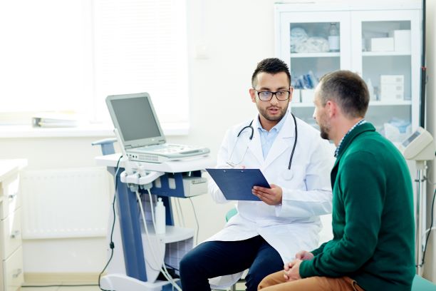 doctor discussing a procedure with male patient
